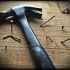 black-claw-hammer-on-brown-wooden-plank-209235