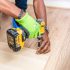 person-holding-dewalt-cordless-hand-drill-1249610